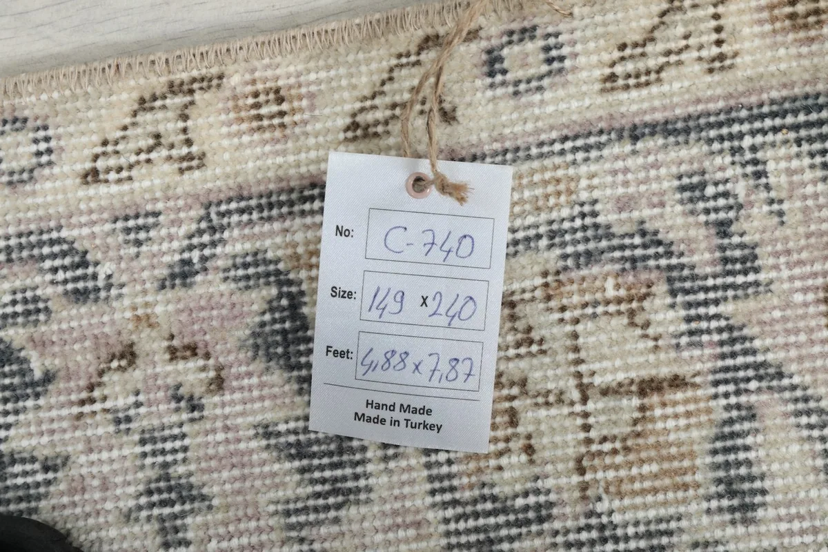 Tag showing the rug's dimensions 149 x 240 cm and origin as hand made in Turkey