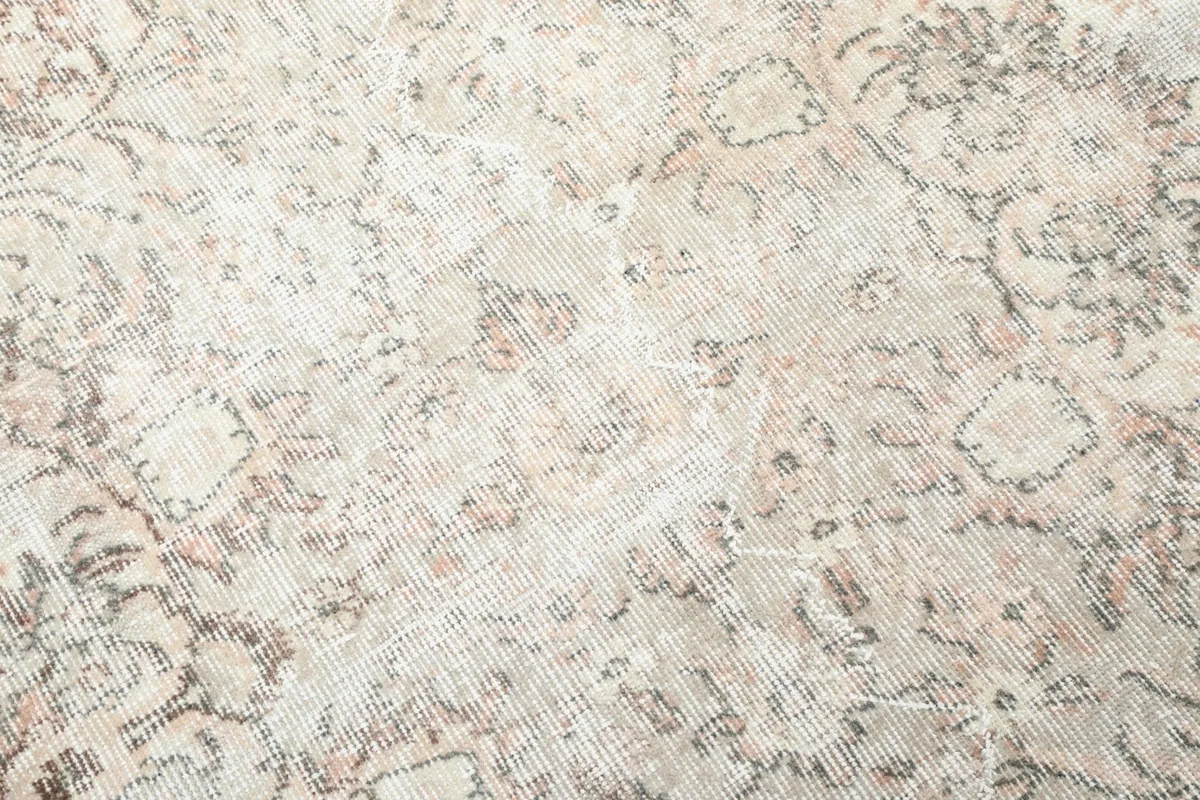 Close-up showing the low pile and texture of the hand-knotted wool surface