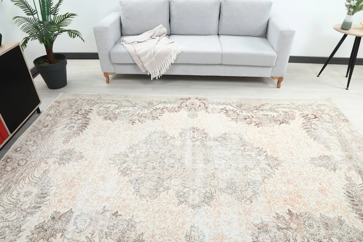 Overhead view of the rug within a room, highlighting its central medallion and surrounding decor