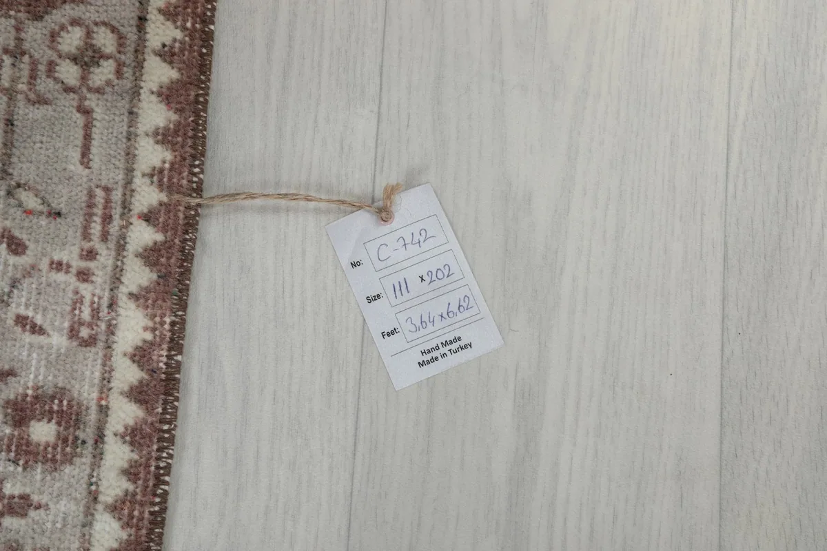 Photo of the rug's tag, indicating its size and origin from Turkey