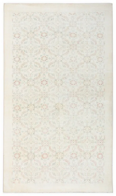 Full top view of the 5'1" x 8'10" ivory vintage Anatolian wool rug