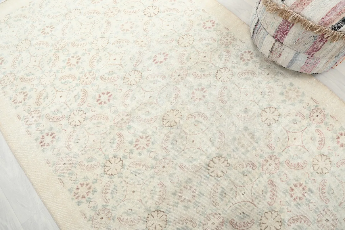 Angled view showcasing the delicate rose and green floral motifs