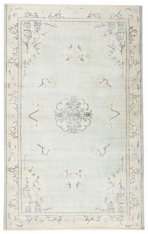 Full top view of the light blue vintage Anatolian rug with a central medallion on a white background.