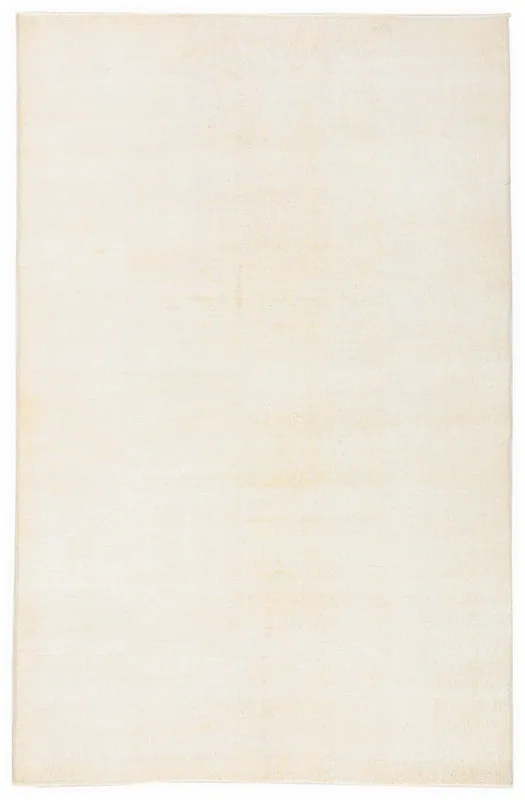 Full top view of the 5'1" x 7'10" ivory vintage Anatolian wool rug.