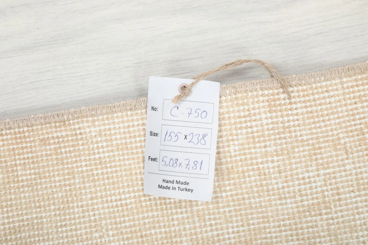 Tag showing rug details including size 155x238 cm and origin 'Hand Made in Turkey'.