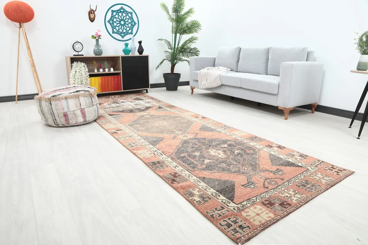 Angled view of the vintage runner rug in a room, showing its length and how it complements the decor.