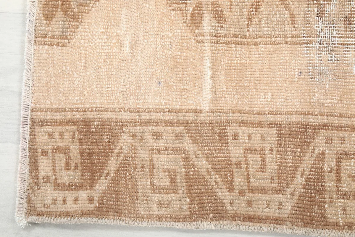 Detailed shot of the border design and fringe of the vintage Anatolian runner