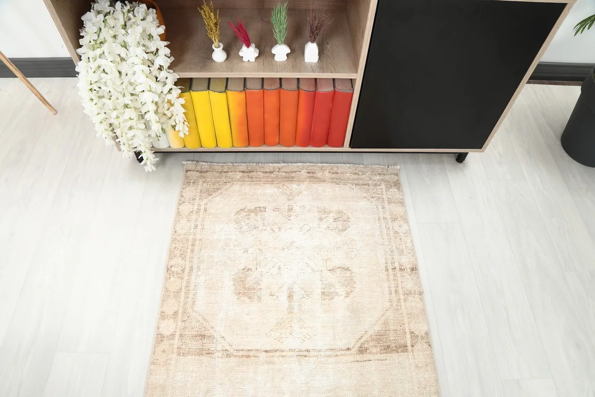 Overhead view of one end of the runner rug, highlighting its faded geometric design