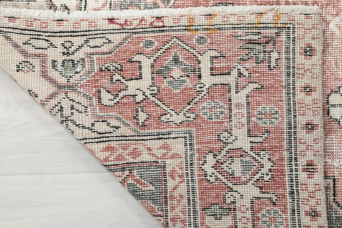 Close-up of the back of the hand-knotted wool rug, revealing its construction