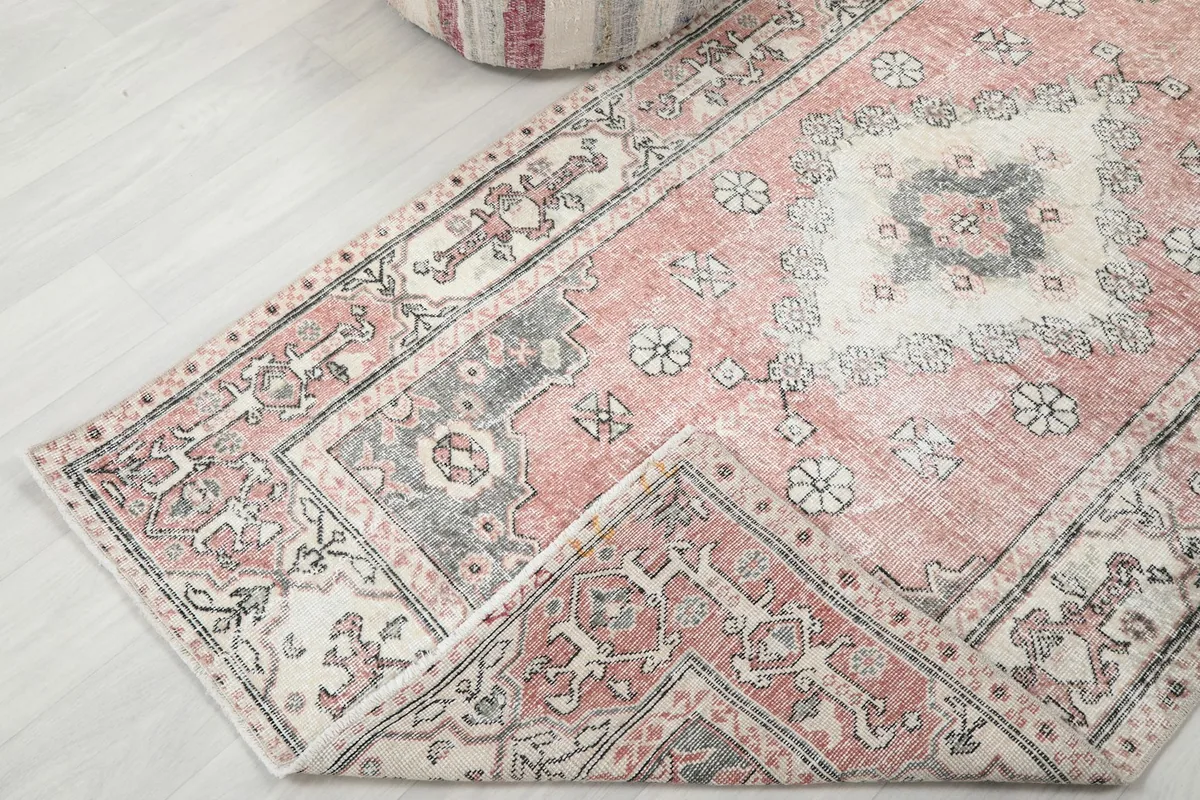 Folded corner of the rug to show the back and foundation texture