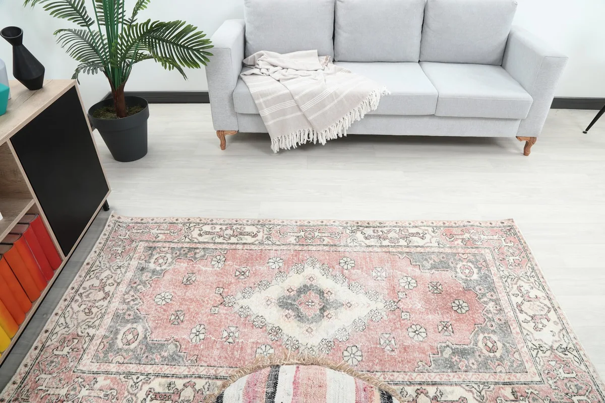 Overhead view of the rug's placement in the room, showing its scale with a sofa