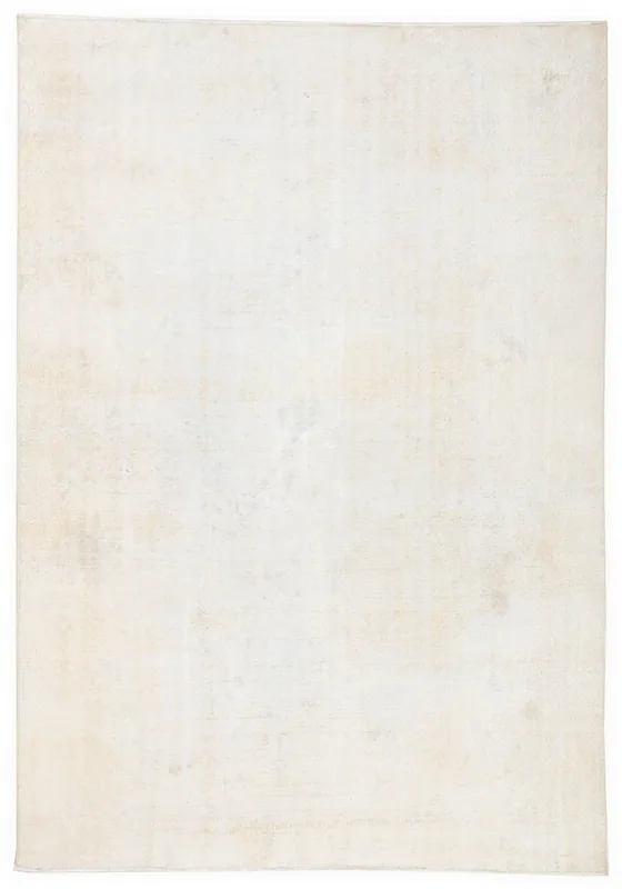 Full overhead view of the 6'6" x 8'11" vintage Anatolian area rug with a muted cream field.