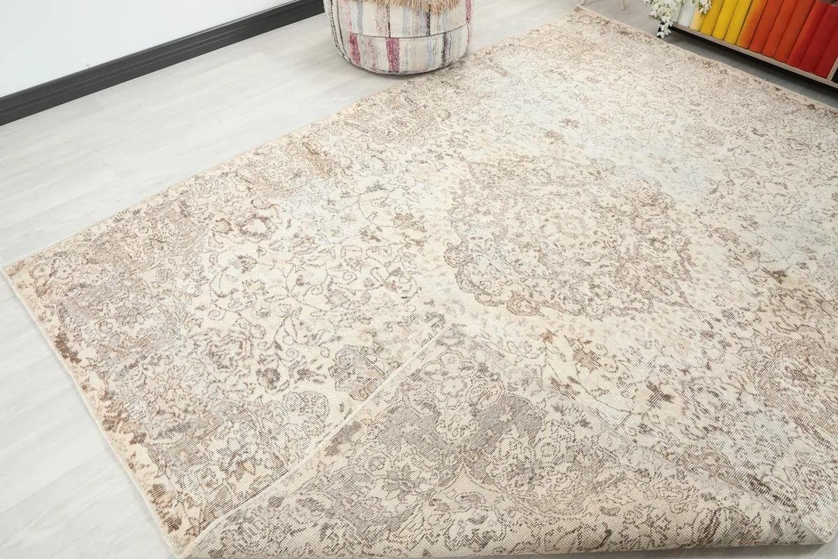 View of the rug folded back, showing the back of the rug and its construction.