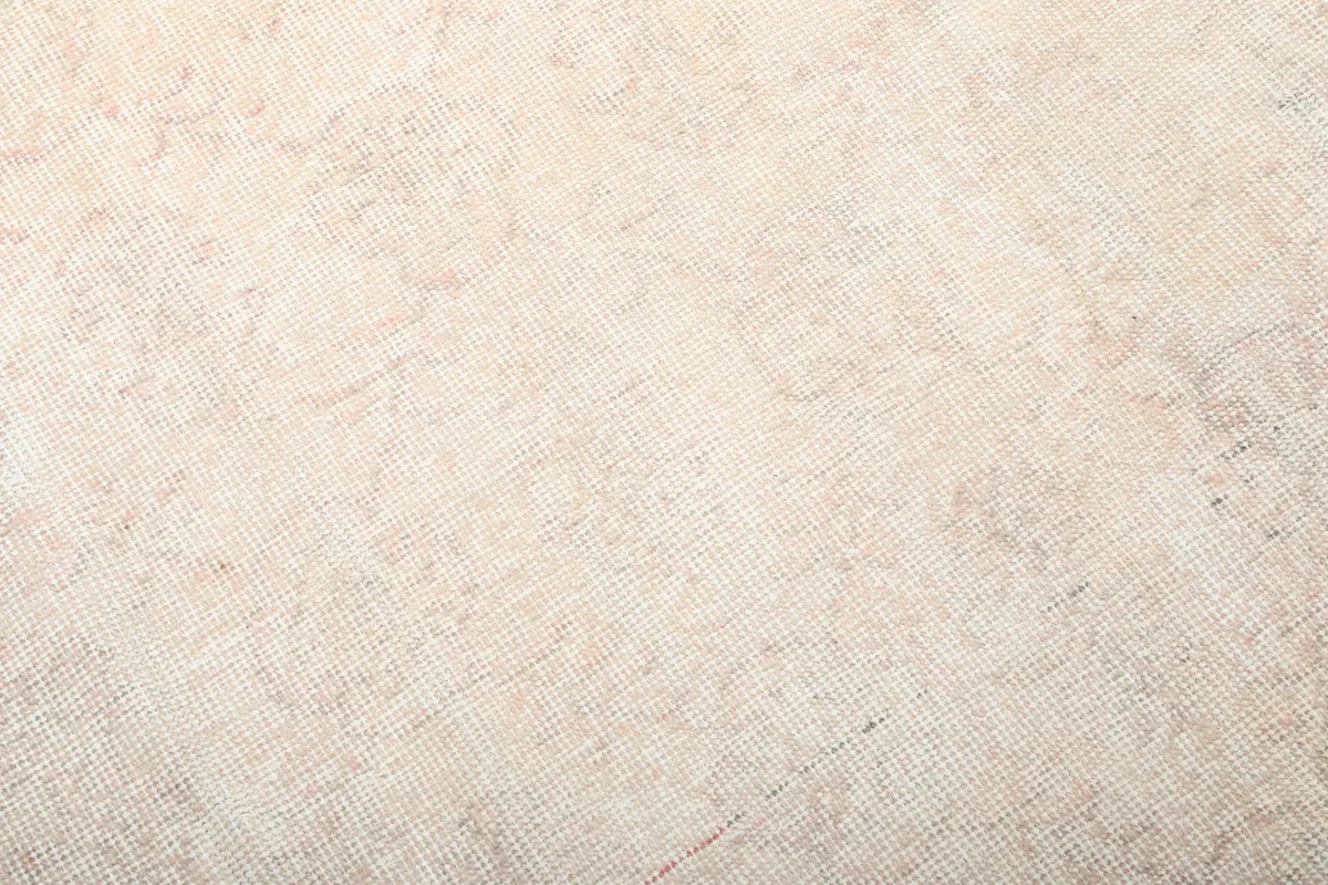 Texture detail of the hand-knotted wool pile, showing the subtle variations in color and weave.