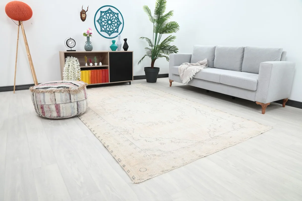 Angle view of the ivory rug in a living room, highlighting its medium size and placement.
