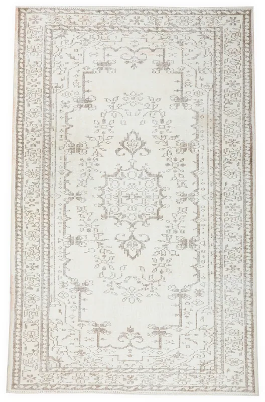 Full top view of the ivory and beige Anatolian vintage area rug