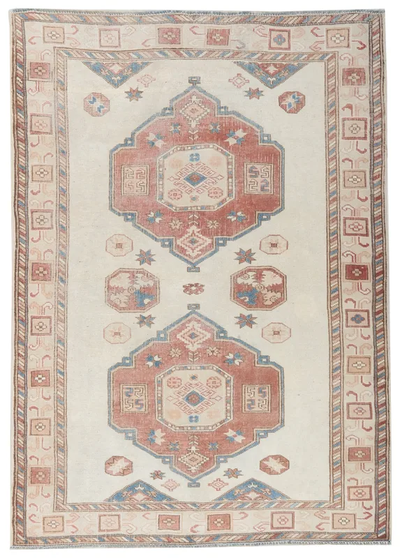 Full overhead view of the 4x6 ivory rust geometric vintage rug with tribal motifs