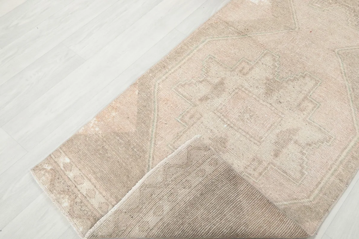 View of the rug folded to show the thickness and flexibility of the hand-knotted construction.