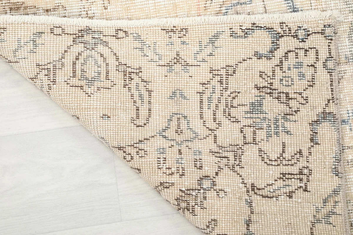 Underside view of the hand-knotted cotton foundation and wool pile