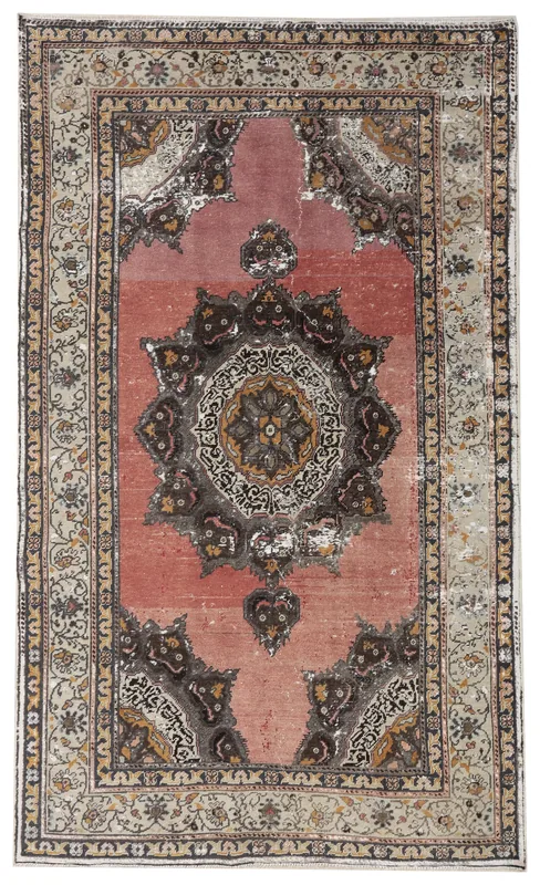 Full overhead view of the 5x8 rose and ivory vintage Anatolian rug on a white background.