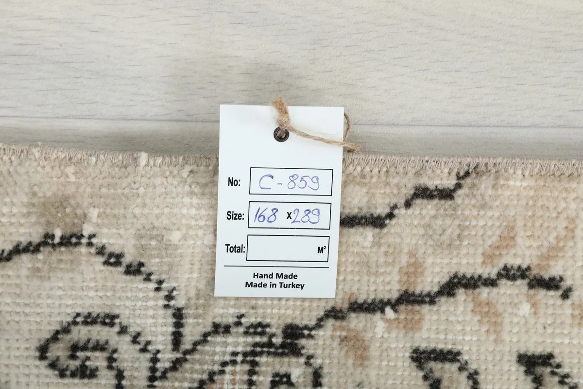 Product tag displaying the rug's item number and size, confirming it is handmade in Turkey