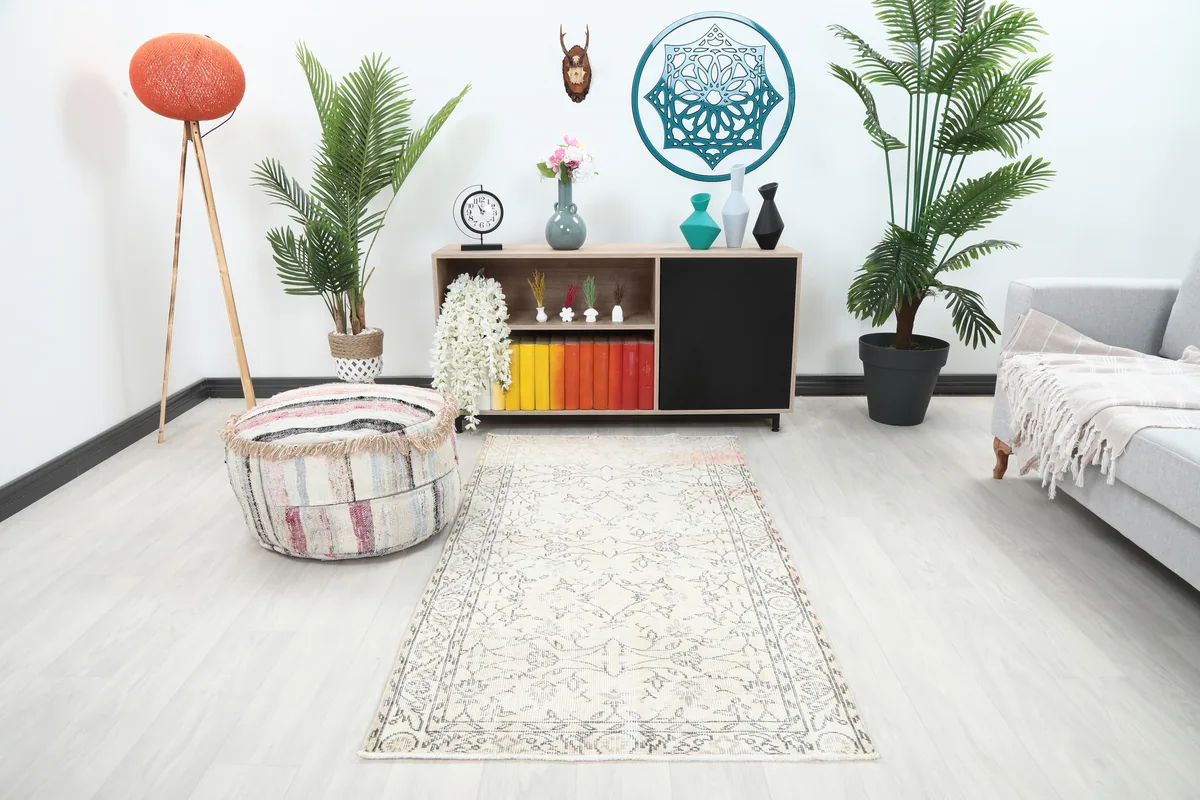 Faded Ivory Floral Anatolian Rug in a modern living space with light-colored walls