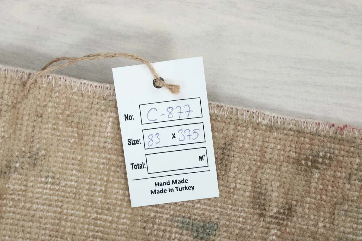 Product tag showing the rug's identification number, size in centimeters, and 'Hand Made in Turkey'.