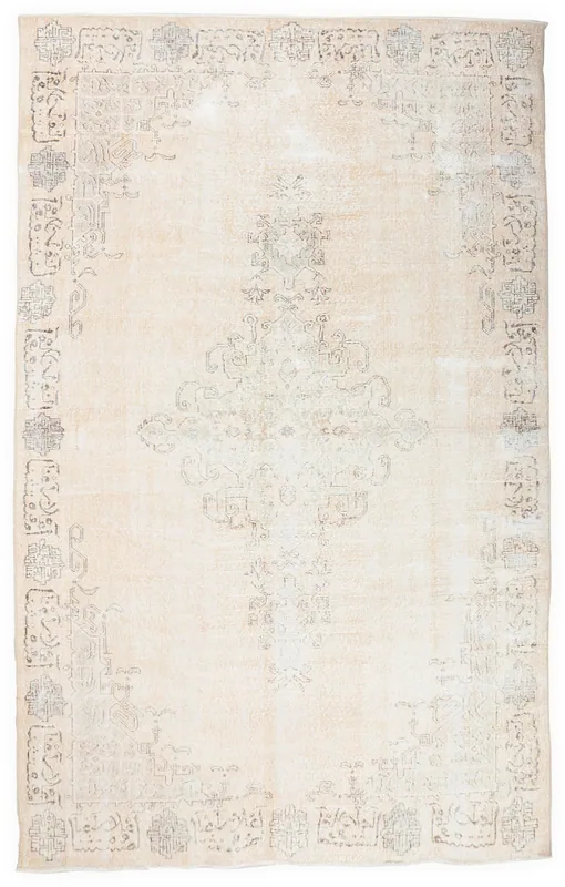 Full overhead view of the 6x10 ivory rug with a faded gray geometric medallion.