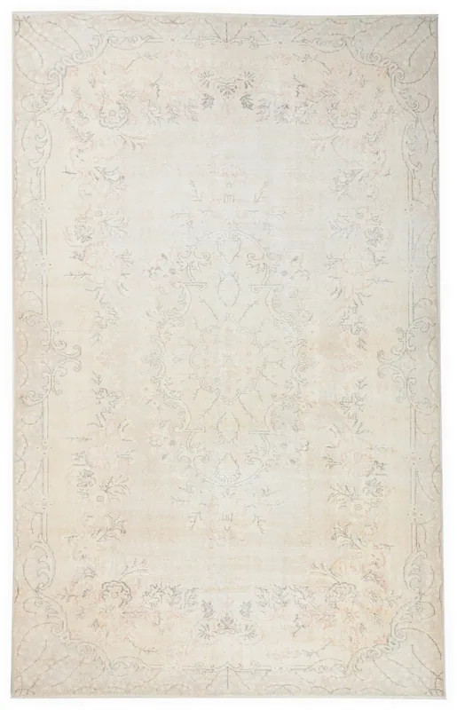 Full top view of the 6'2" x 9'11" muted ivory floral vintage Anatolian rug on a white background.