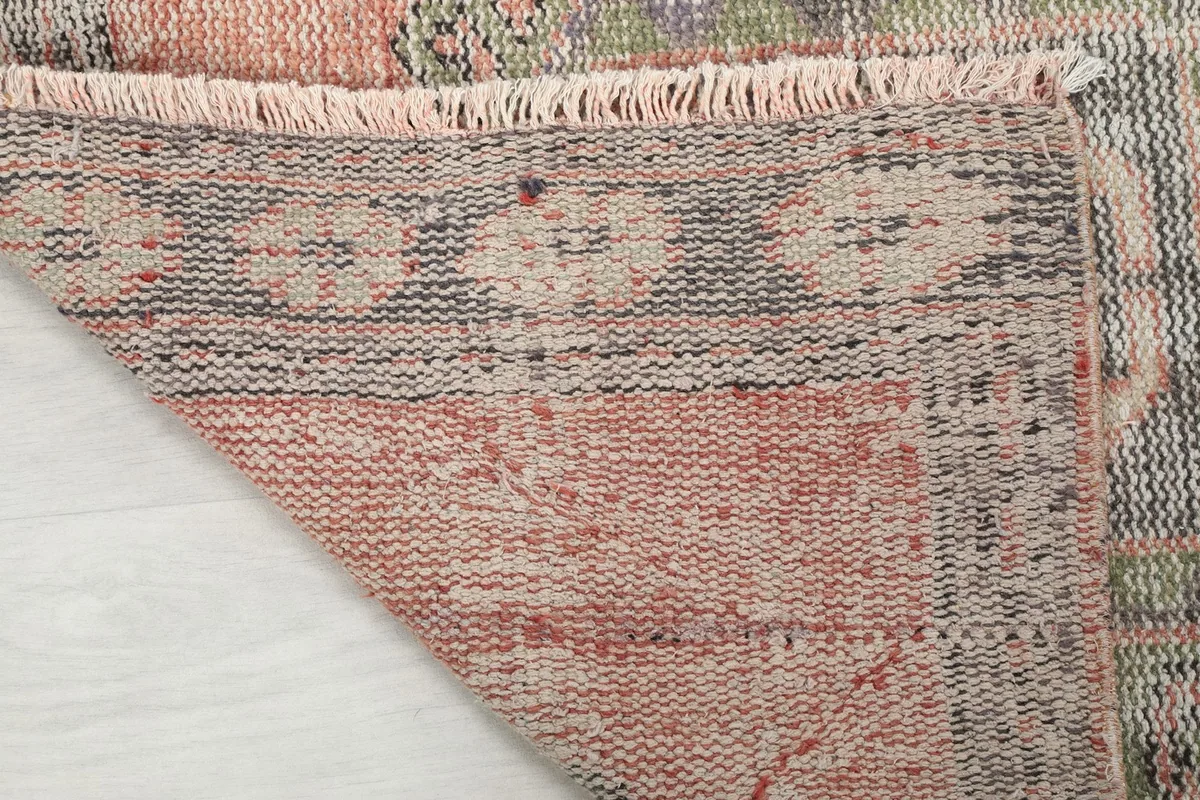 View of the back of the vintage Anatolian runner, showing the tightly woven cotton foundation and the reverse of the pattern.