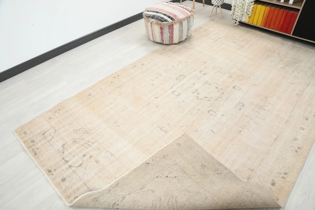 Corner of the rug folded to show the underside and overall texture