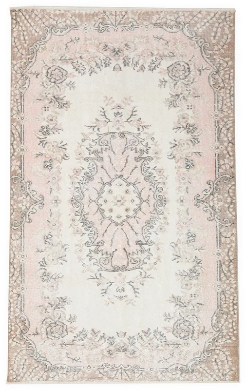 Full top view of the 4x6 pink and cream vintage Anatolian area rug on a white background.