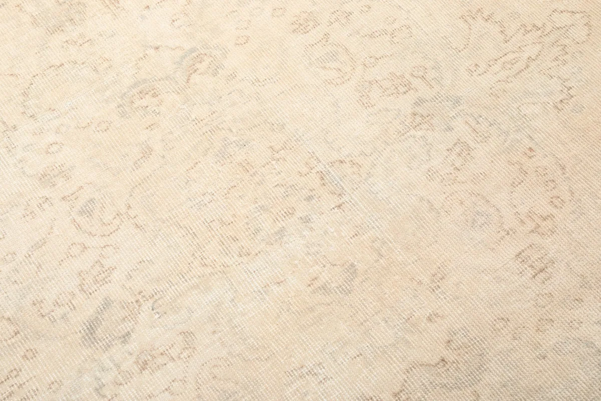 Close-up of the subtle pattern and texture of the hand-knotted wool pile