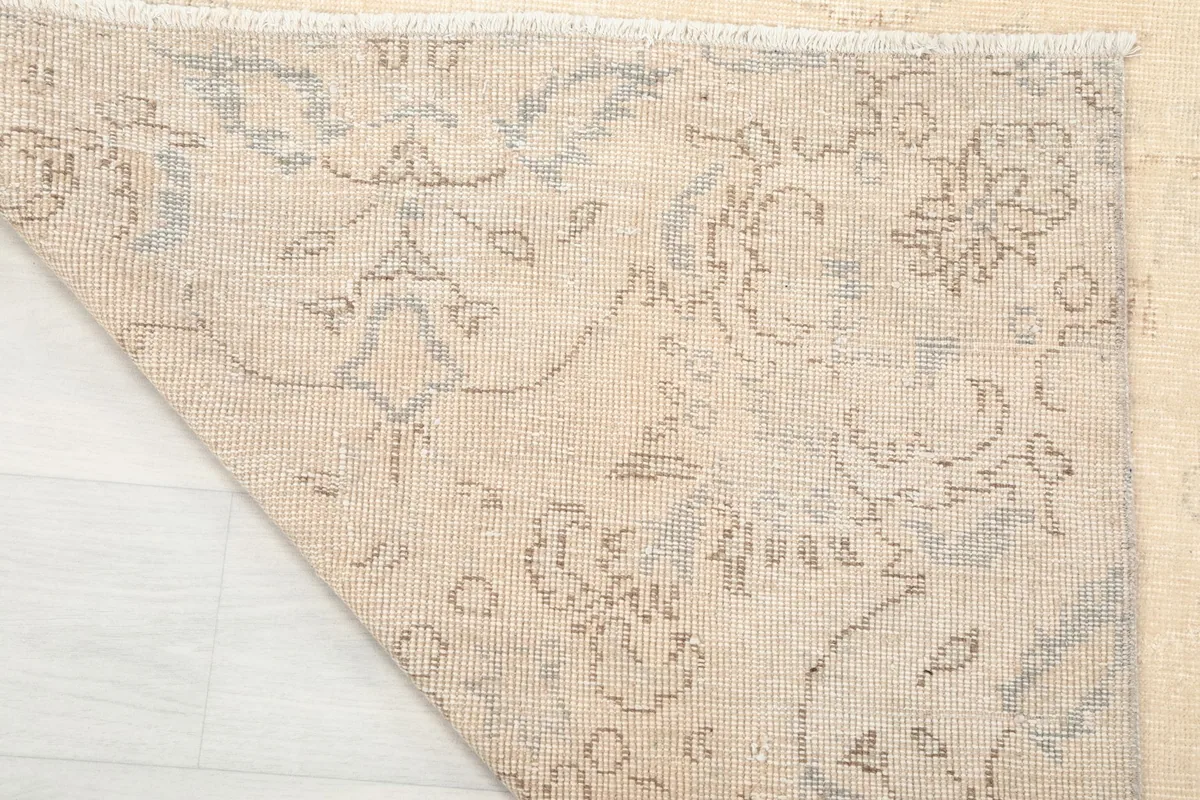 Close-up of the rug's reverse side, revealing the hand-knotted construction