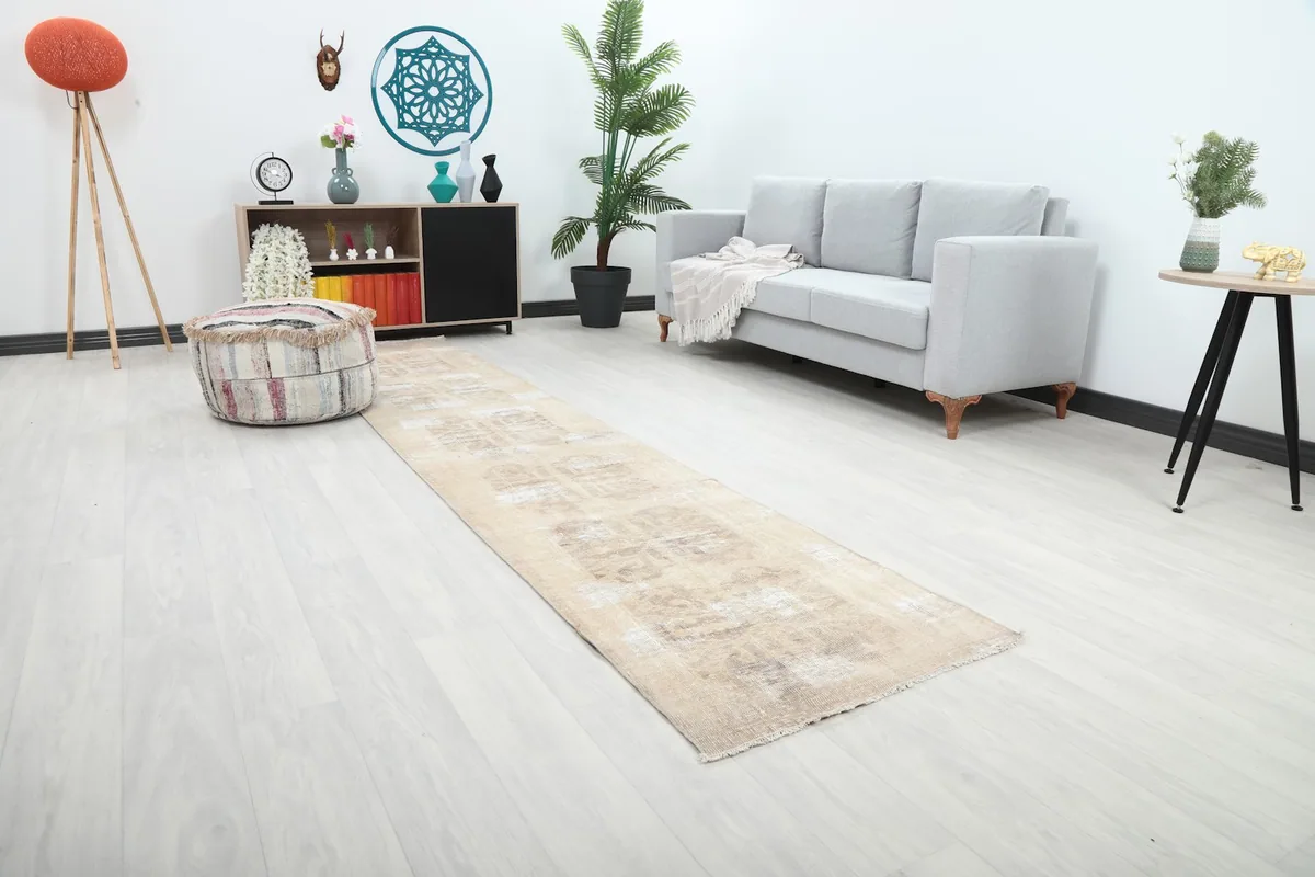 Another angle of the runner rug in a room setting, showcasing its length and subtle design.