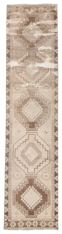 Full top view of the 2'11" x 12'9" vintage Anatolian runner rug with cream and brown geometric patterns