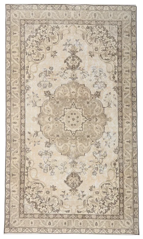 Full overhead view of the 4'8" x 8'0" beige and brown vintage Anatolian wool rug on a white background.