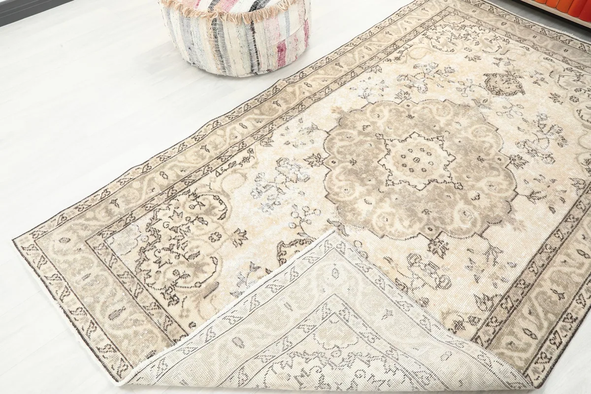 View showing the low pile and underside of the hand-knotted vintage Anatolian wool rug.