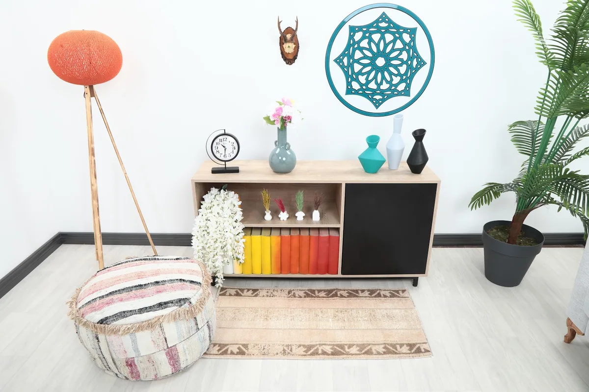 Vintage tan and brown rug placed in a modern living space with a low console.