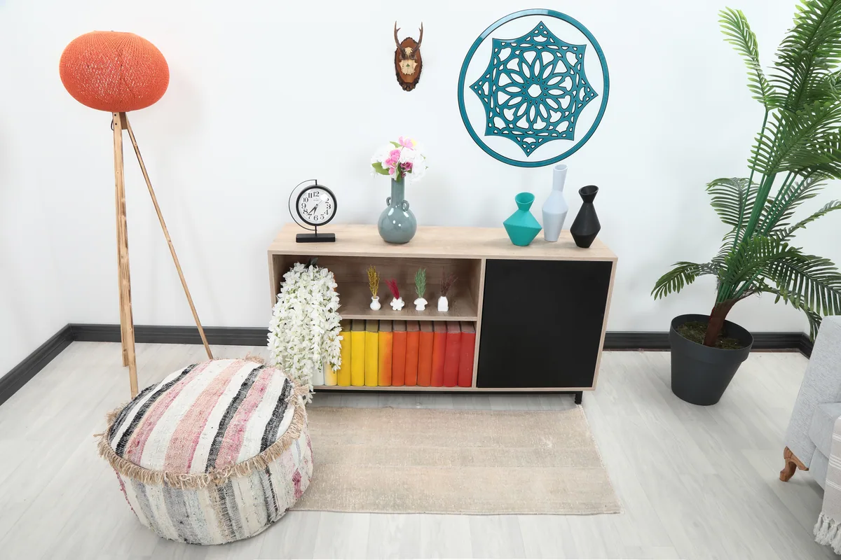 Faded Beige Minimalist Anatolian Rug in a living room setting, positioned in front of a console table.