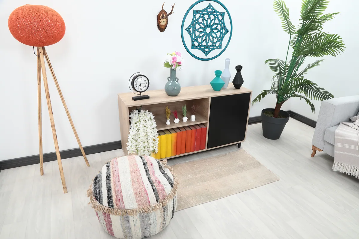 Faded Beige Minimalist Anatolian Rug in a home decor setting, showing its size relative to furniture.