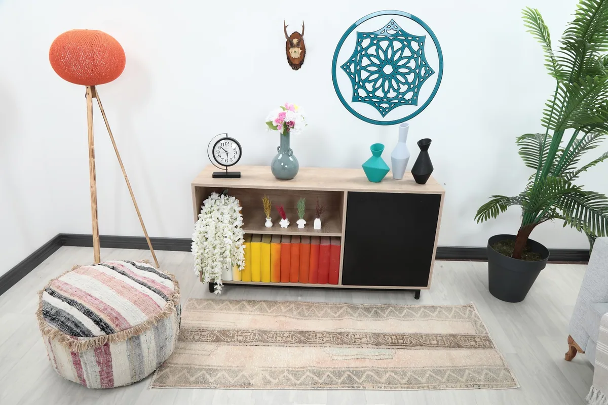Muted tribal runner rug in a living room setting with light furniture