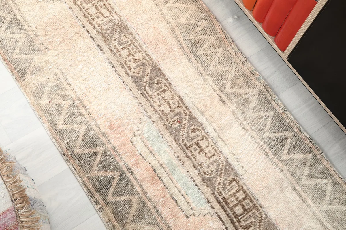 Detailed view of the zigzag border and striped sections of the vintage runner