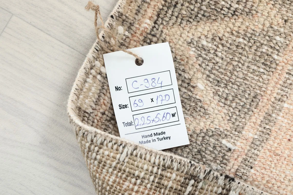 Product tag showing the rug's dimensions and origin on the reverse side