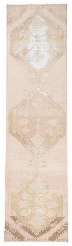 Full overhead view of the 3x12 rose and beige geometric vintage runner rug on a white background