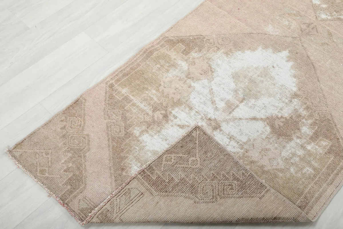 View of the back of the vintage Anatolian runner rug, revealing its cotton foundation and knotting