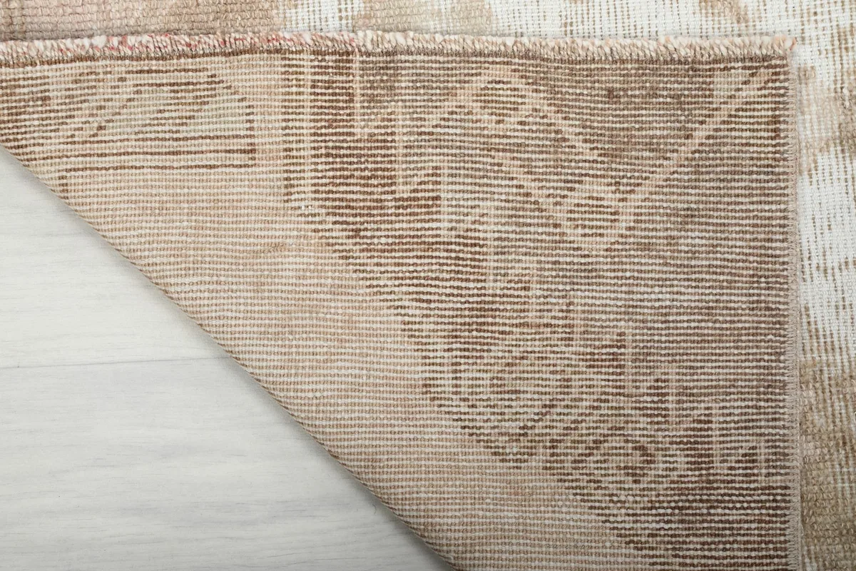 Close-up of the reverse side of the runner rug, highlighting the hand-knotted wool on cotton foundation