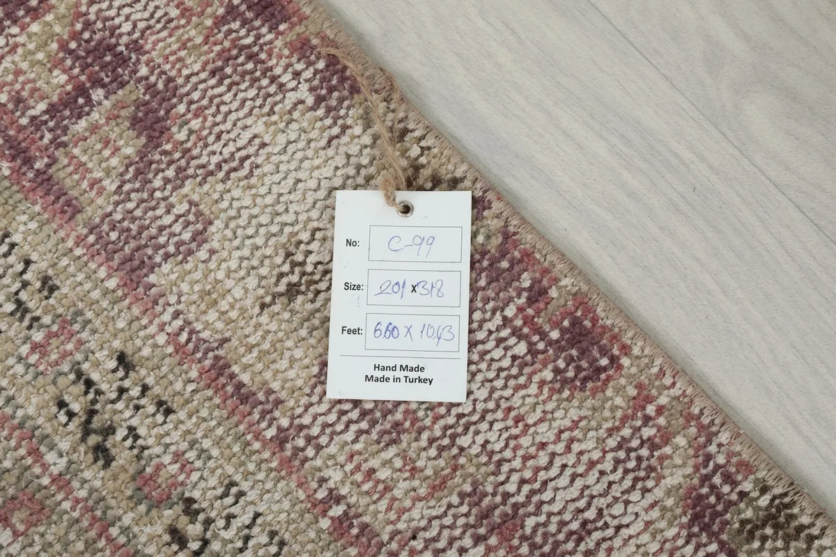 Tag attached to the rug's corner, displaying product information including size and origin