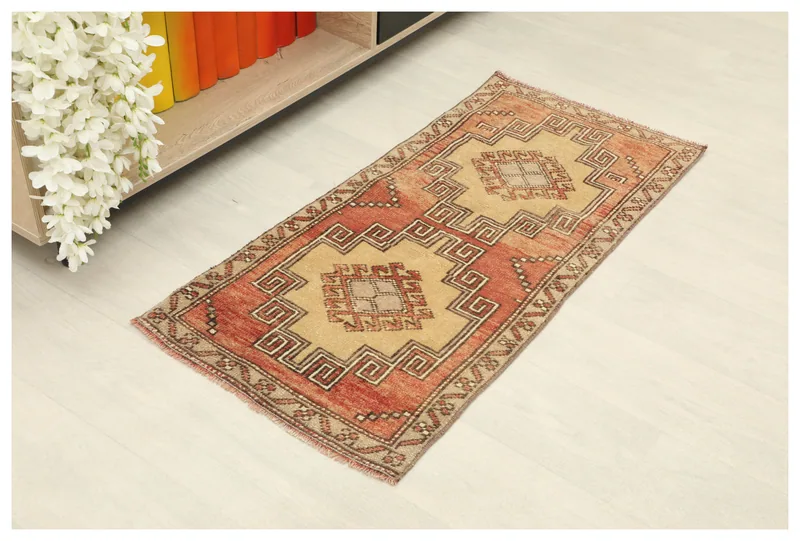 Full overhead view of the 1'8" x 3'6" vintage Anatolian rug with rust and beige geometric patterns.