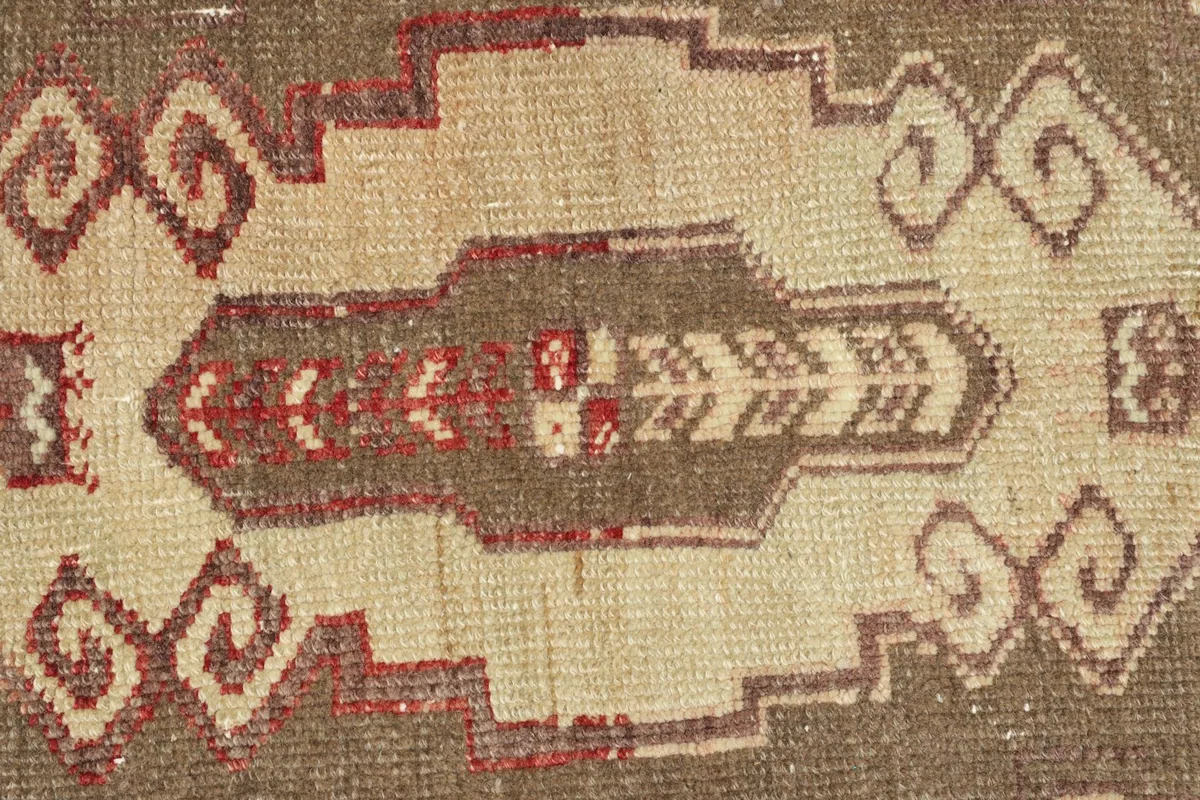 Detailed view of the intricate tribal patterns and texture in the rug's center.